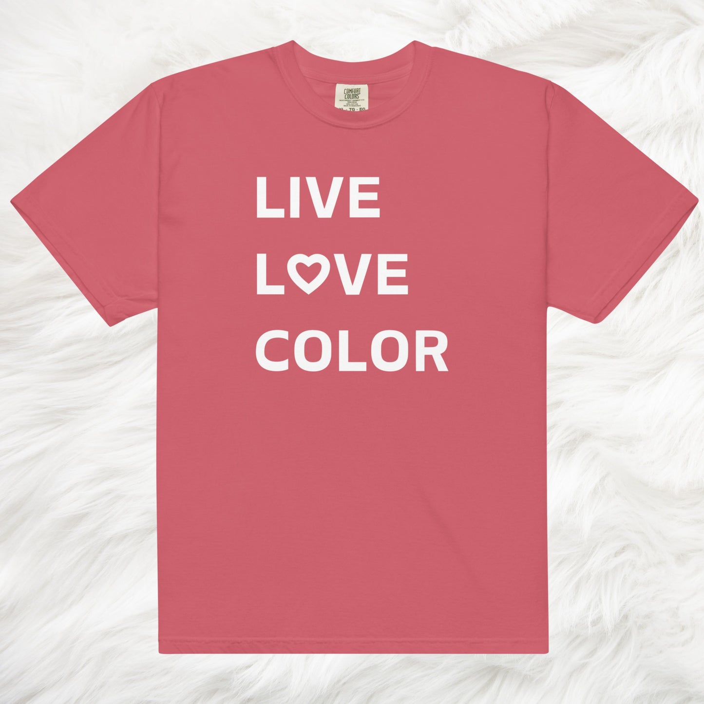 Watermelon color T-Shirt with white bold print that says LIVE LOVE COLOR. The letter O in the word LOVE has been replaced with a heart symbol.