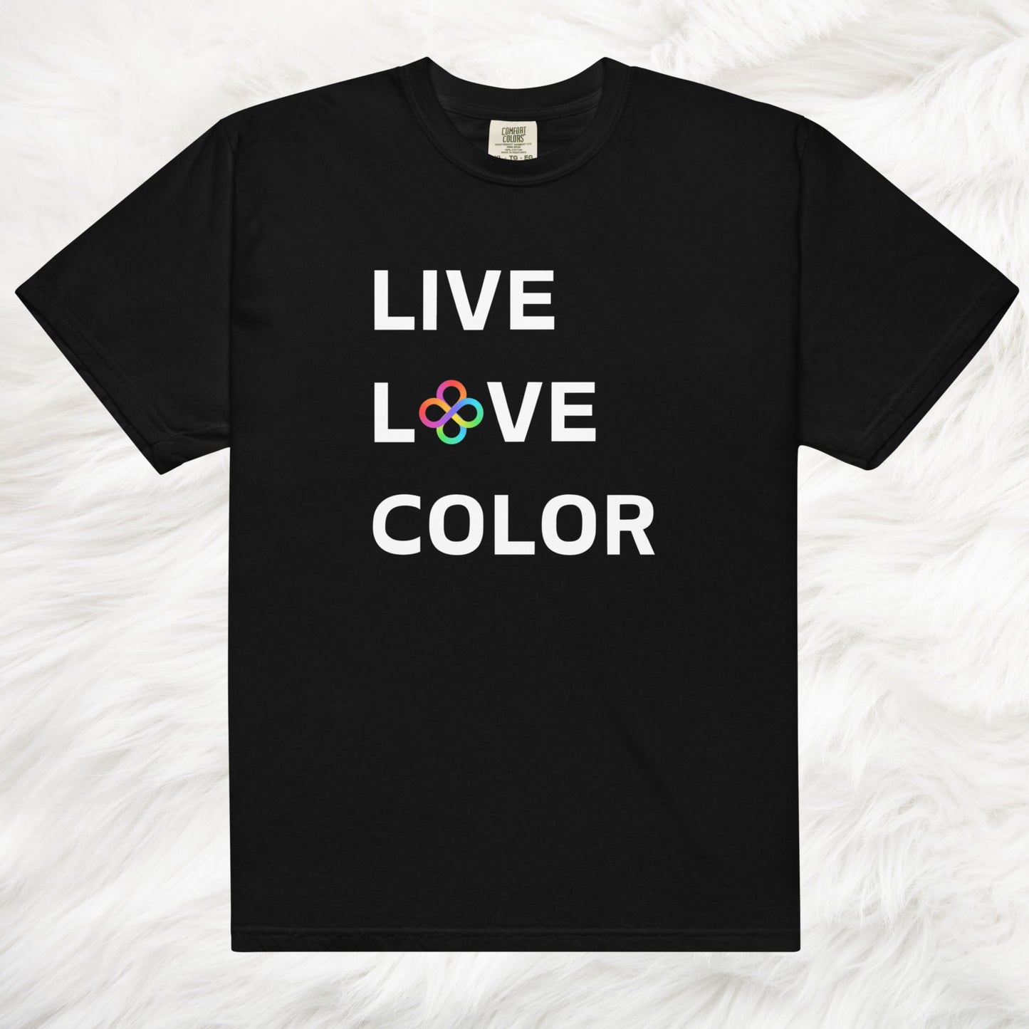 Black color tshirt with white bold print that says LIVE LOVE COLOR. The letter O in the word LOVE has been replaced with rainbow infinity symbols.