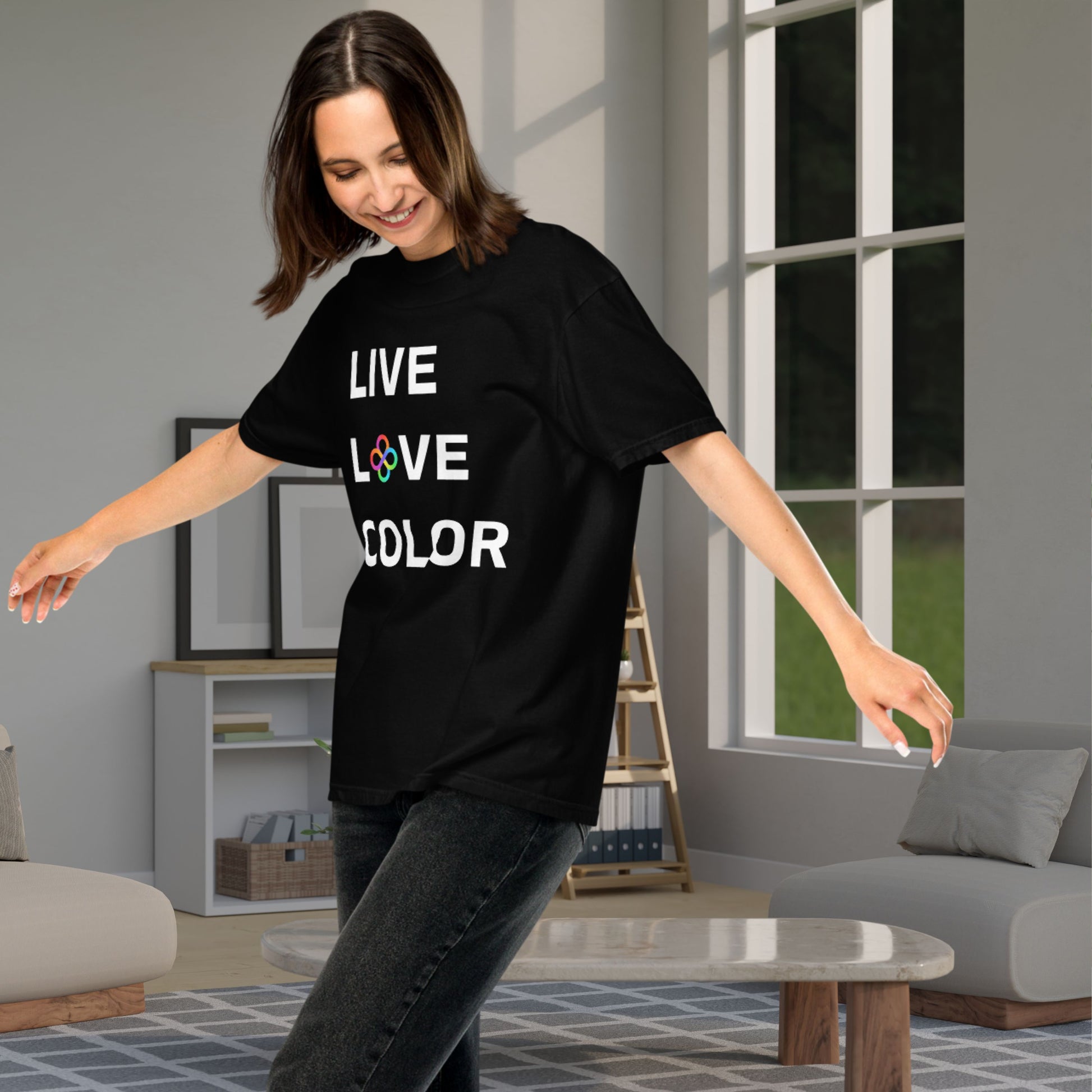 Black color tshirt with white bold print that says LIVE LOVE COLOR. The letter O in the word LOVE has been replaced with rainbow infinity symbols.