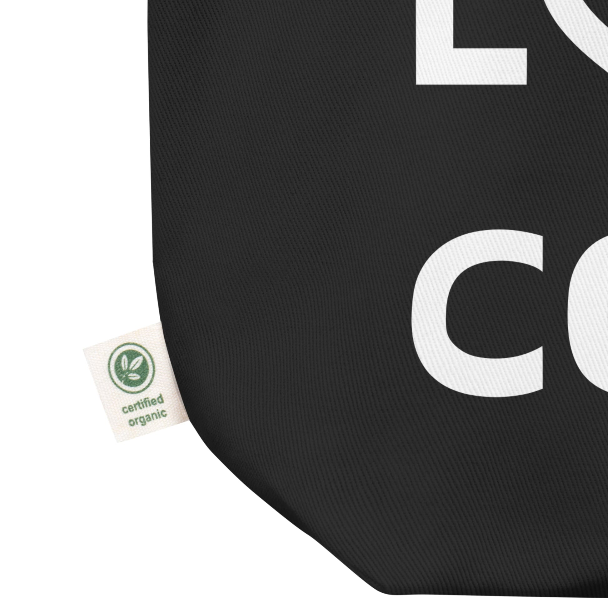 Black canvas tote bag with white bold print that says LIVE LOVE COLOR. The letter O in the word LOVE has been replaced with a heart symbol.