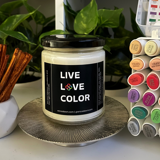Hand-poured vegan soy wax candle. Soy wax inside a glass jar, a single cotton wick, with an outside label that says LIVE LOVE COLOR, with a screw top lid. The letter O in the word LOVE has been replaced with two rainbow infinity symbols.