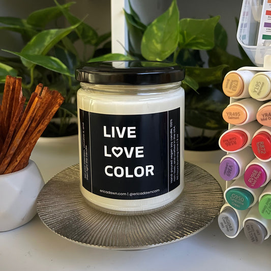 Hand-poured vegan soy wax candle. Soy wax inside a glass jar, a single cotton wick, with an outside label that says LIVE LOVE COLOR, with a screw top lid. The letter O in the word LOVE has been replaced with a heart symbol.