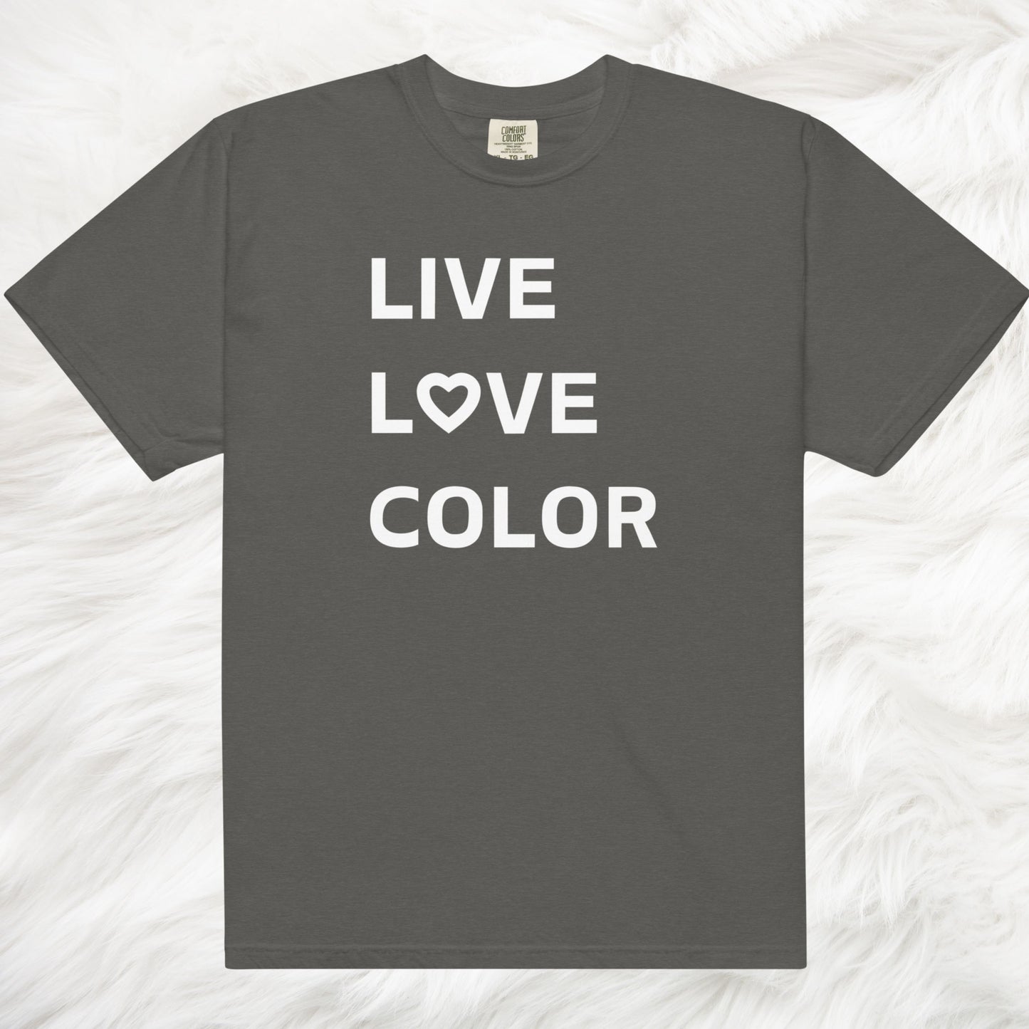 Pepper color T-Shirt with white bold print that says LIVE LOVE COLOR. The letter O in the word LOVE has been replaced with a heart symbol.