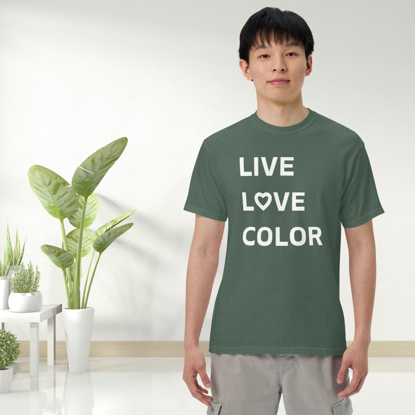 Blue Spruce color T-Shirt with white bold print that says LIVE LOVE COLOR. The letter O in the word LOVE has been replaced with a heart symbol.