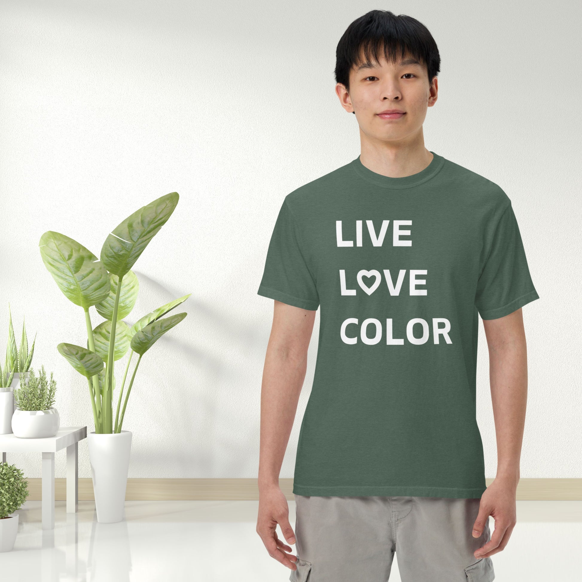 Blue Spruce color T-Shirt with white bold print that says LIVE LOVE COLOR. The letter O in the word LOVE has been replaced with a heart symbol.
